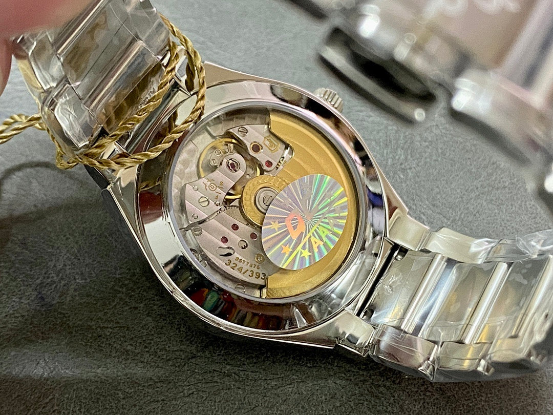 Patek Philippe watch with case open, visible movement and gold-toned interior