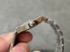 Patek Philippe steel watch case with diamond-set bezel and polished edges