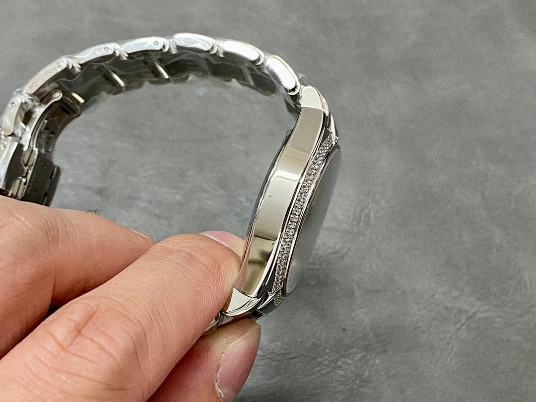 Patek Philippe steel watch case with diamond bezel, side view of bracelet