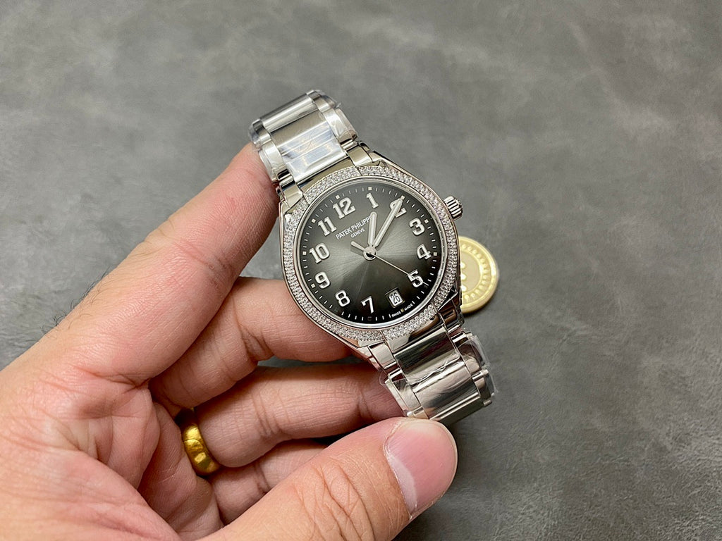 Patek Philippe steel watch with diamond bezel and dark dial, side profile