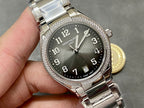 Patek Philippe steel watch with dark dial, diamond bezel and date window