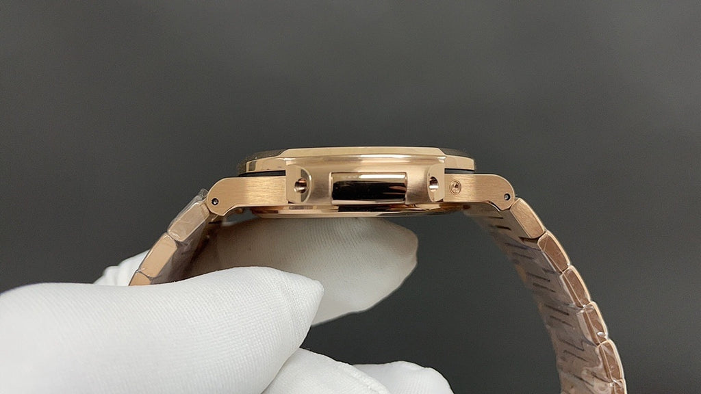 Patek Philippe watch with gold-tone bracelet and polished case back