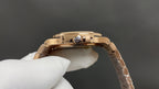Patek Philippe watch with gold-tone case back and central rotor jewel