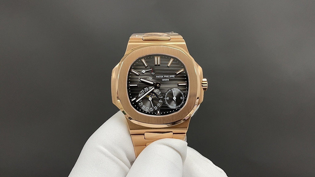 Patek Philippe rose gold wristwatch with black dial, chronograph subdials