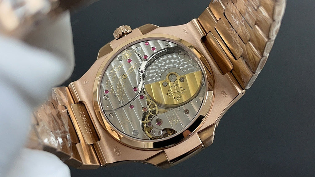 Patek Philippe rose gold open caseback watch, visible movement and bracelet