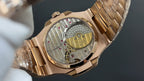 Patek Philippe rose gold open caseback watch, visible movement and bracelet