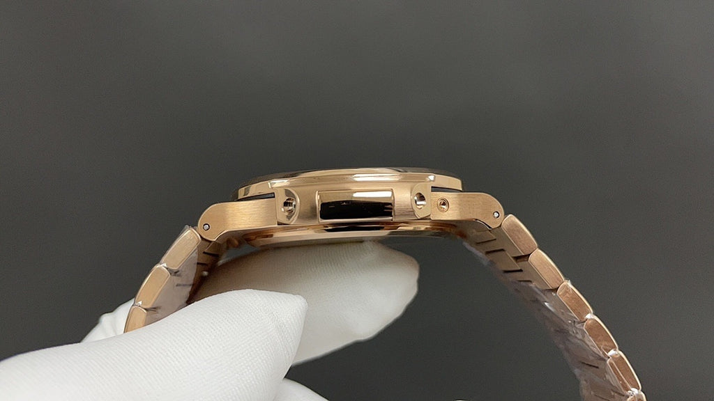 Patek Philippe rose gold wristwatch side view with crown and bracelet links