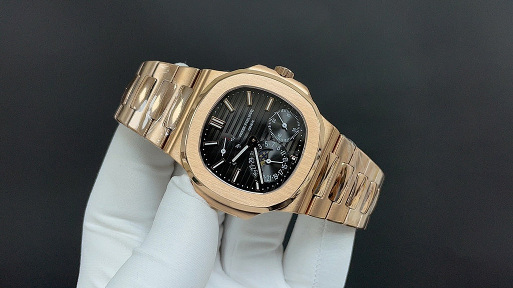 Patek Philippe rose gold bracelet wristwatch with black dial and subdials