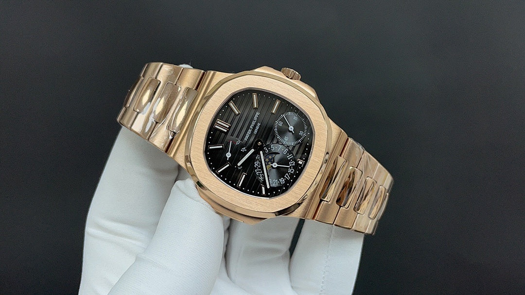 Patek Philippe rose gold bracelet wristwatch with black dial and subdials