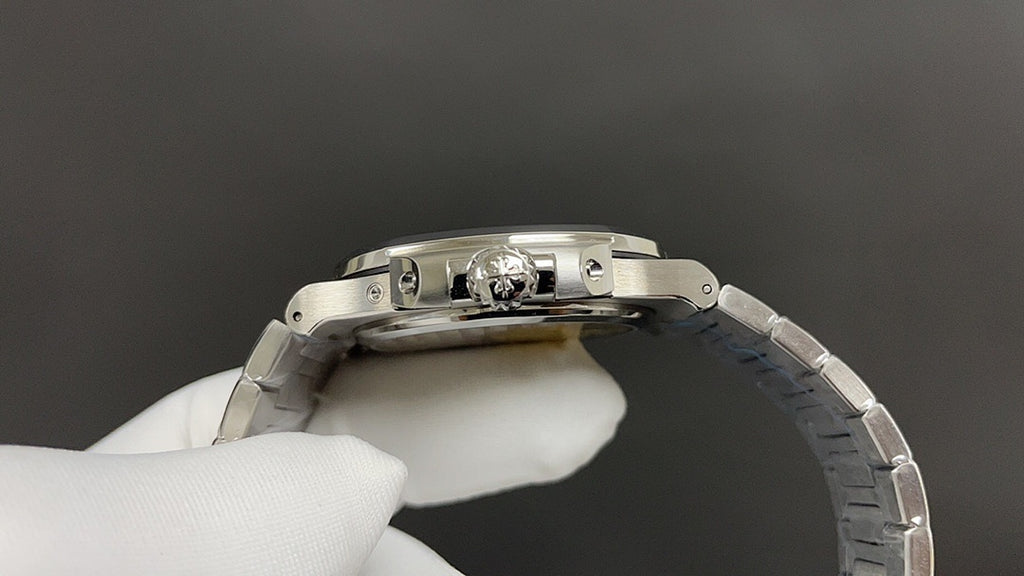 Stainless steel watch case with exposed movement components, clear window at top