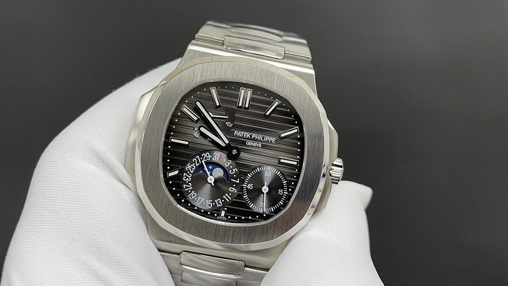 Stainless steel watch with black dial, blue accent hands, chronograph subdials