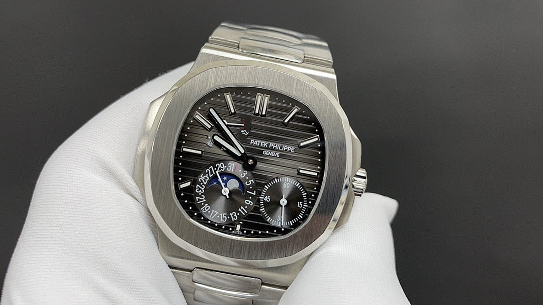 Stainless steel watch with black dial, blue accent hands, chronograph subdials