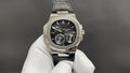 Patek Philippe watch, black dial with subdials, steel case and black leather strap
