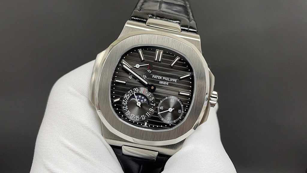 Patek Philippe watch, front view with black dial, steel case and black leather strap