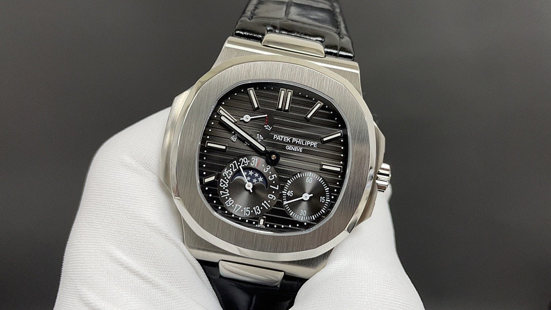 Patek Philippe watch, front view with black dial, steel case and black leather strap