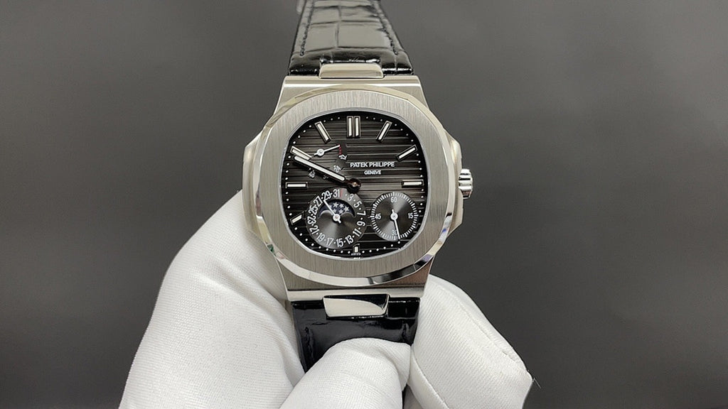 Patek Philippe watch close-up, black dial, steel case and black leather strap