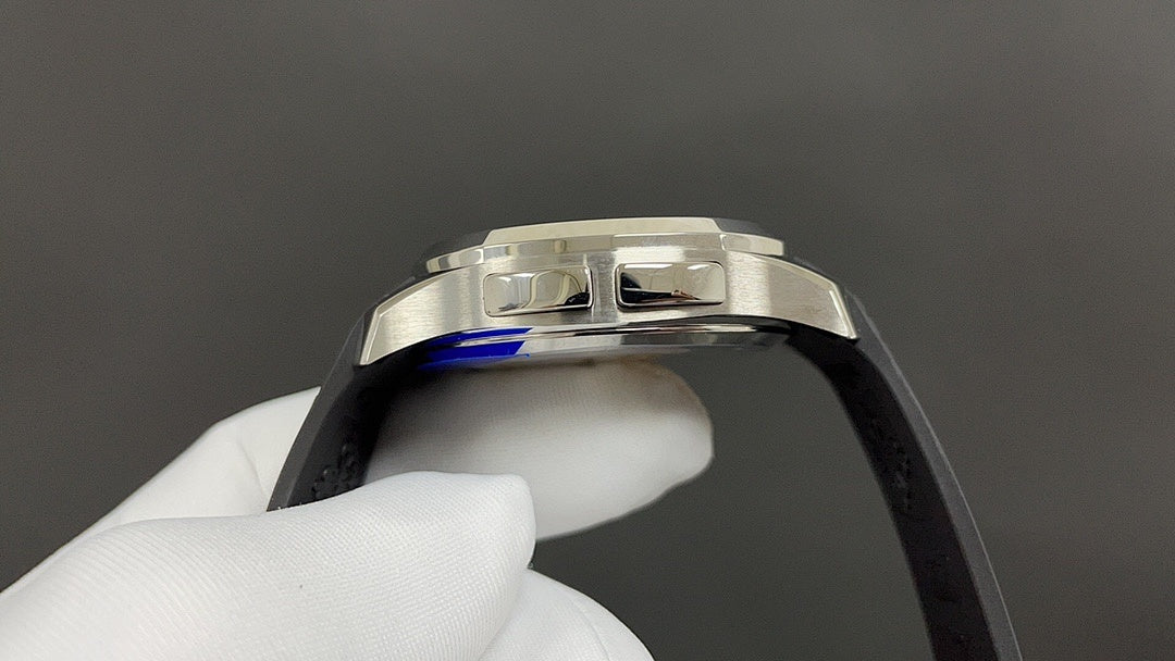 Patek Philippe watch case and bezel detail with black rubber strap