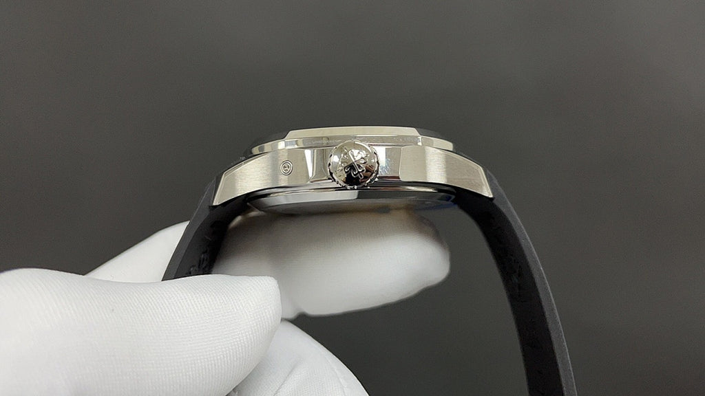 Patek Philippe wristwatch with jeweled crown and black rubber strap