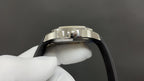 Patek Philippe wristwatch with jeweled crown and black rubber strap