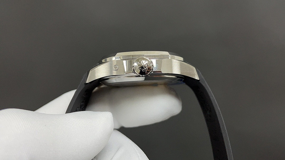 Patek Philippe wristwatch with jeweled crown and black rubber strap