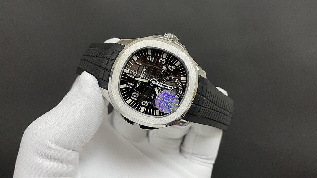 Patek Philippe wristwatch side view with black dial and purple gear detail