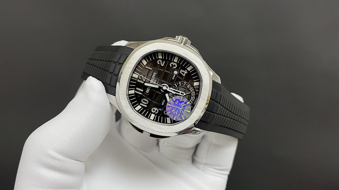 Patek Philippe wristwatch side view with black dial and purple gear detail