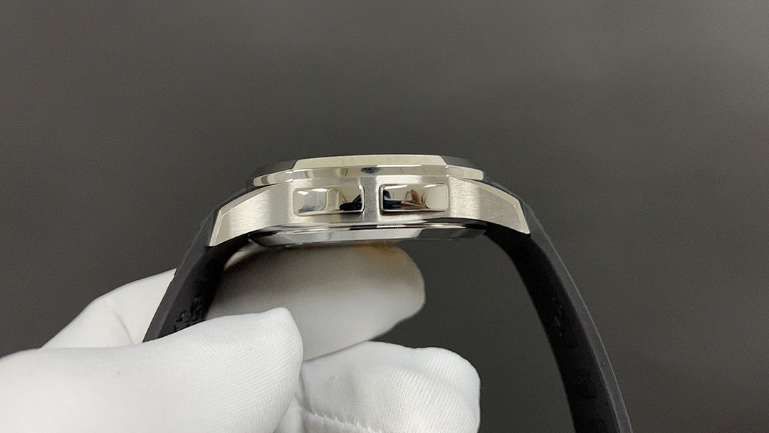 Patek Philippe watch with silver case and black strap, side profile