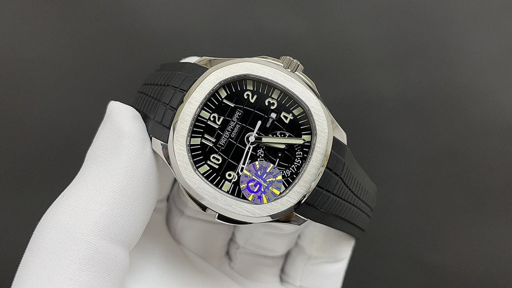 Patek Philippe watch with black dial, rainbow reflection, steel case, gray strap