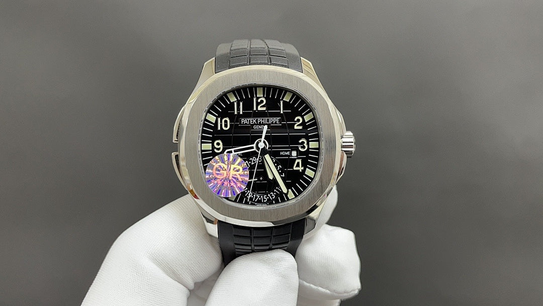 Patek Philippe watch on gloved hand, black dial, gold-tone bezel, black strap