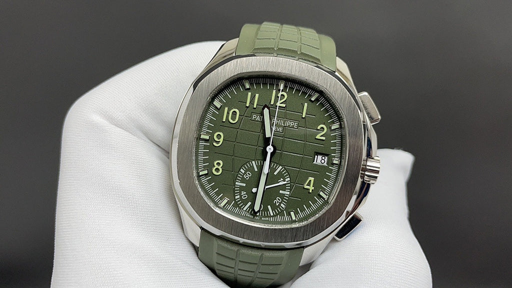 Round wristwatch with green dial and green rubber strap, silver-tone case on white gloves