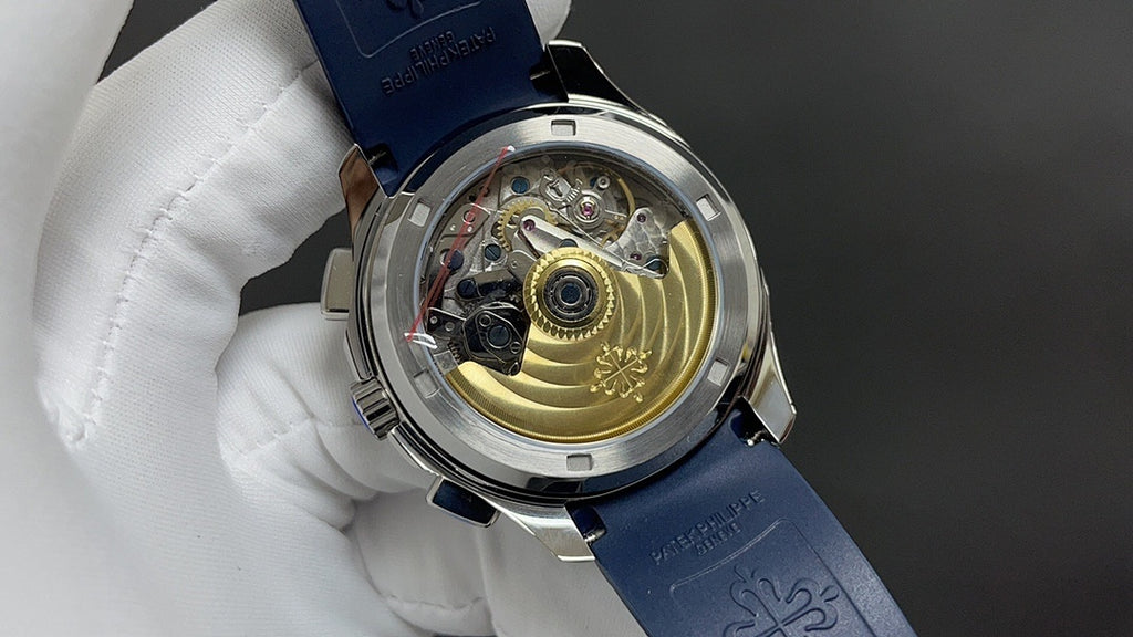 Patek Philippe watch case back with visible movement on blue strap