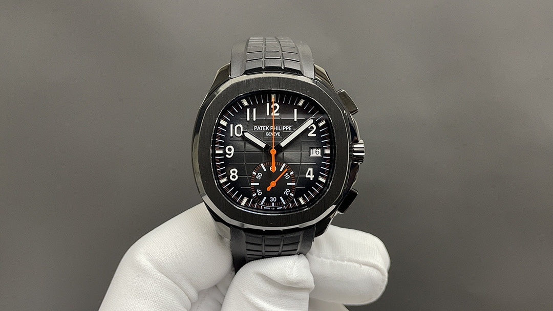 Patek Philippe wristwatch with black dial, orange hands, and black steel bracelet