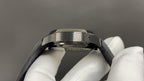 Patek Philippe watch caseback with brushed metal bezel and black strap