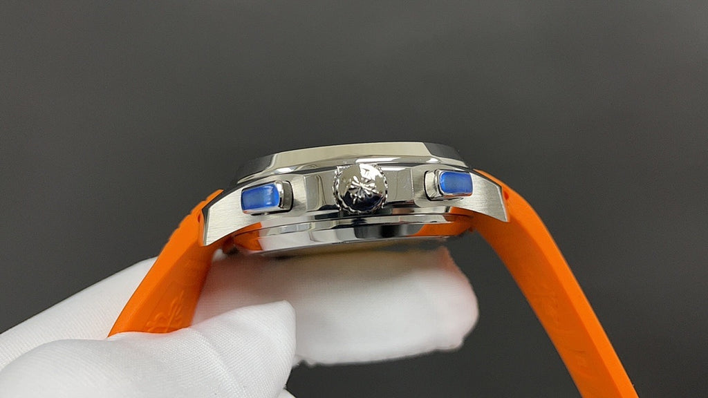 Patek Philippe wristwatch top view with orange strap, stainless case and blue accents.