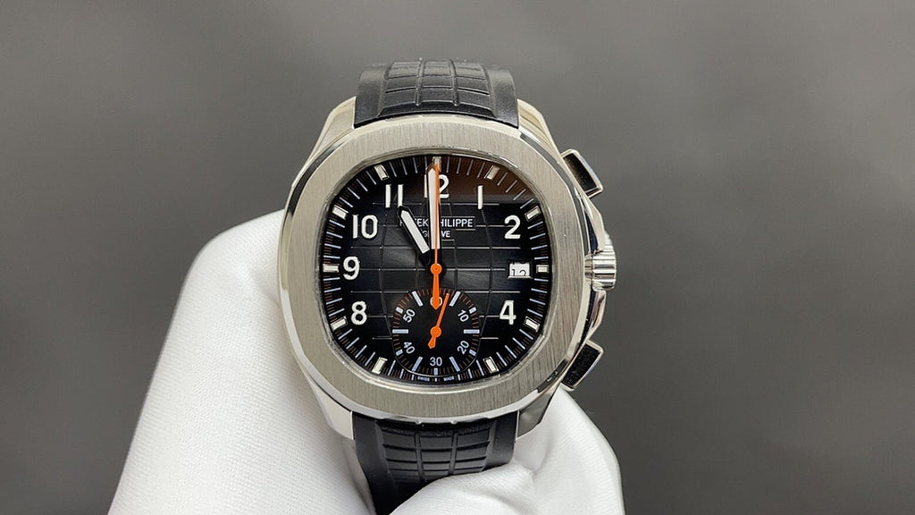 Patek Philippe watch with black dial, orange accents, stainless case, black leather strap