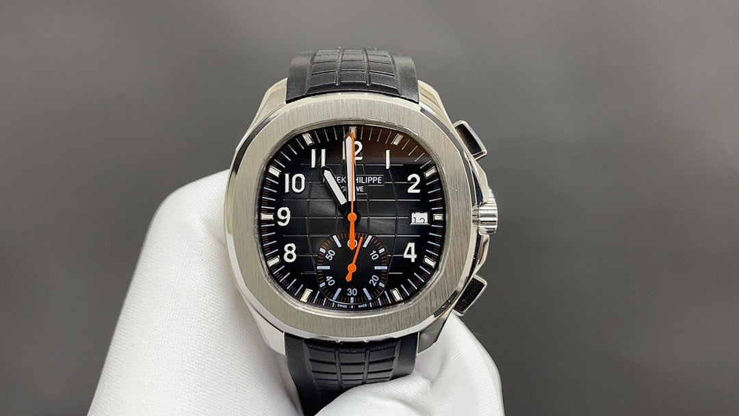 Patek Philippe watch with black dial, orange accents, stainless case, black leather strap