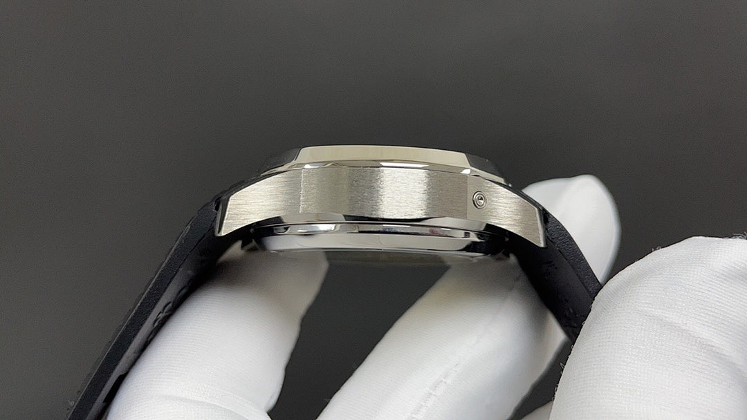 Patek Philippe watch case profile with black strap and silver bezel