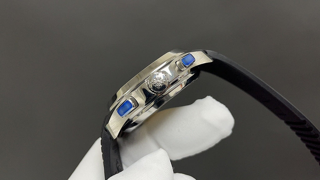 Patek Philippe watch side with crown and blue accents, black strap, stainless case