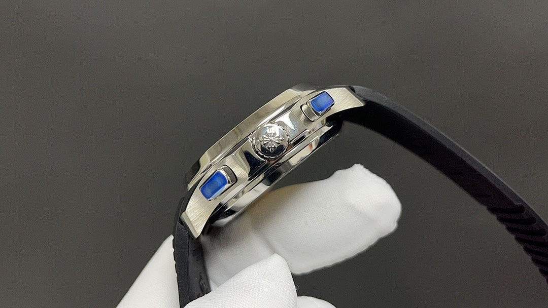 Patek Philippe watch side with crown and blue accents, black strap, stainless case