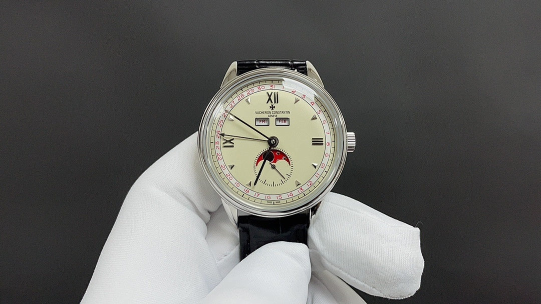 Stainless steel wristwatch with cream dial, Roman numerals, black leather strap, crown at 3