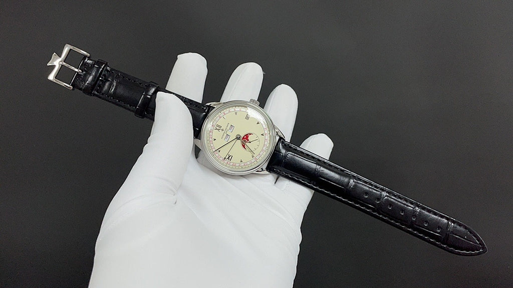 Wristwatch with black leather band extended across gloves; cream dial with Roman numerals
