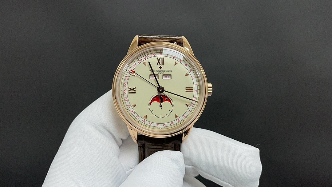 Patek Philippe wristwatch with gold-tone case, white dial, brown leather strap