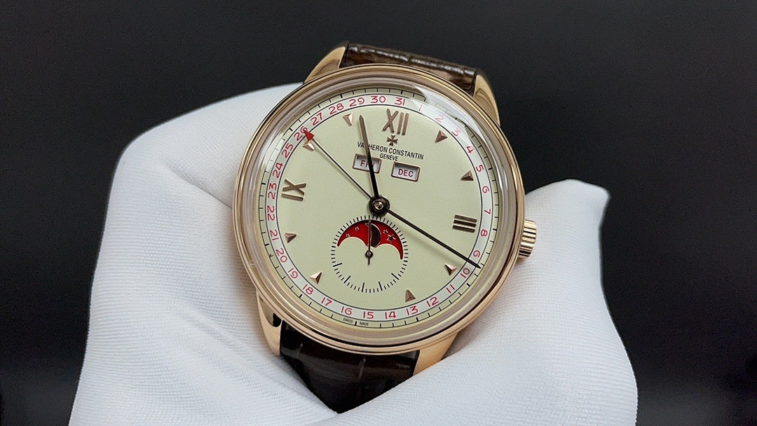 Luxury wristwatch with gold-tone case, white dial and brown leather strap