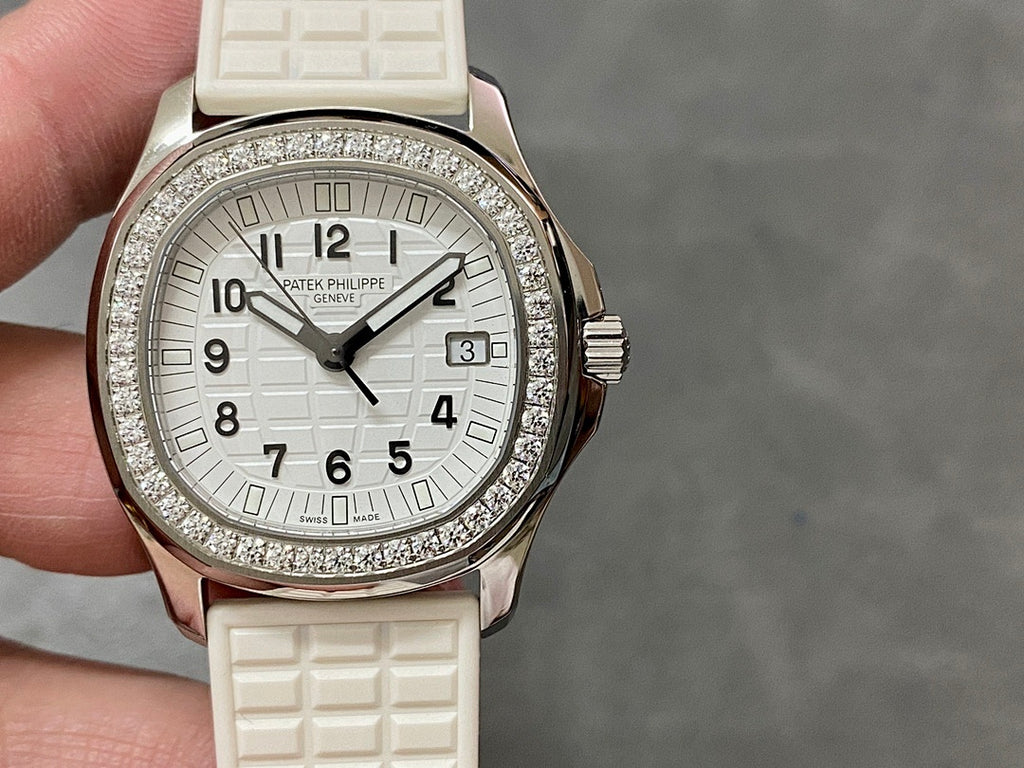Diamond bezel wristwatch with white dial, rose gold case, textured white rubber strap
