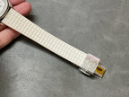 Textured white rubber watch strap with silver buckle and decorative star emblem
