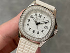Diamond bezel luxury wristwatch with white dial and textured white strap, rose gold case
