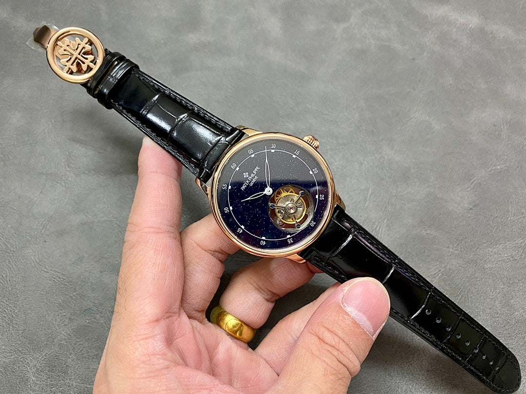 Patek Philippe wristwatch on hand, navy starry dial, open movement, black leather strap