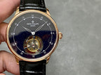 Patek Philippe wristwatch front view, navy star dial, visible mechanism, black leather strap