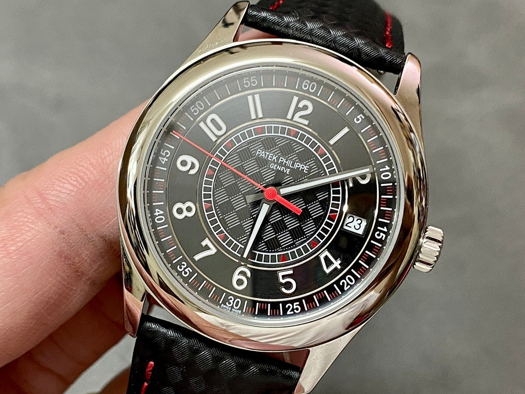 Round stainless watch with dark dial, red accents, and black patterned leather strap