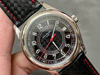 Round watch with dark dial, red seconds hand, and black textured leather strap